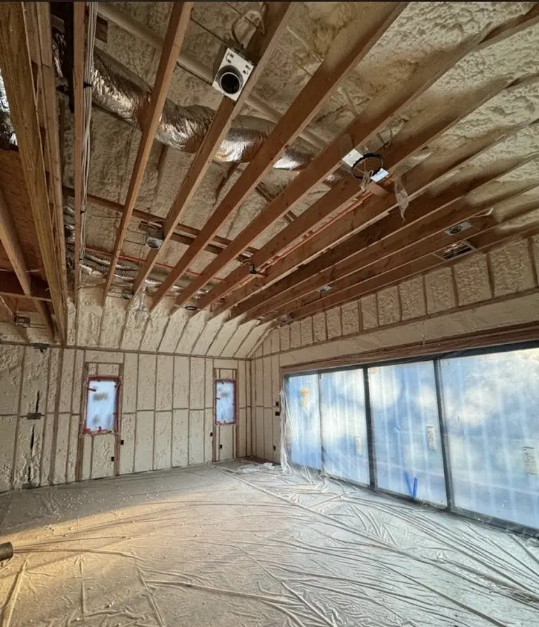 Interior walls and ceiling insulated with spray foam during new construction in Lake Barrington